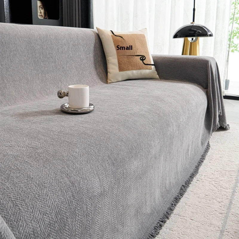 Slate Grey heavyweight sofa throw draped over a minimalist couch with a white coffee mug.