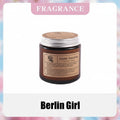Aroma Sensation scented candle labeled 'Berlin Girl' with fragrance description on a colorful background