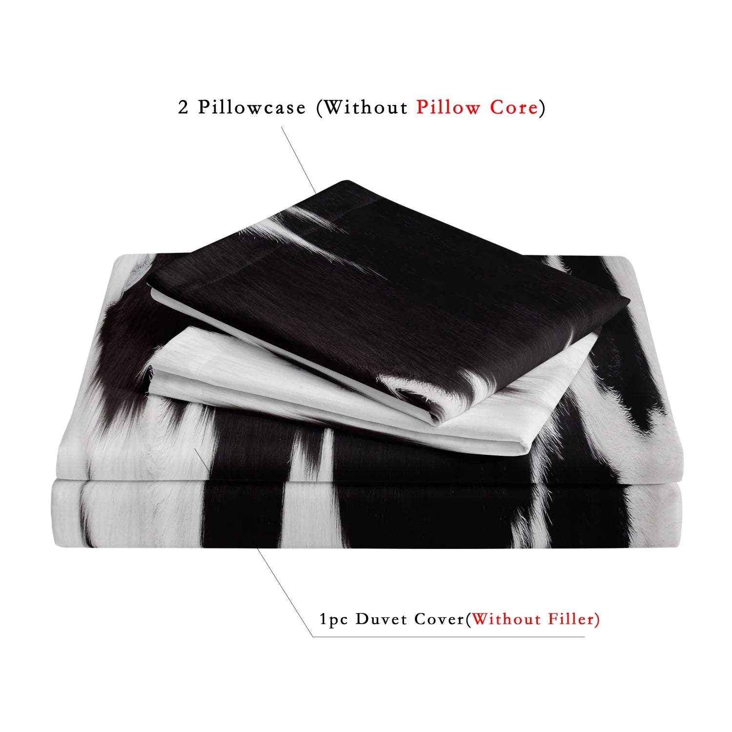 Black and white cow print 3-piece bedding set with matching pillowcases styled on a modern bed