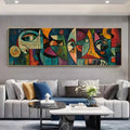 Modern living room with a colorful abstract painting on the wall above a gray sofa.
