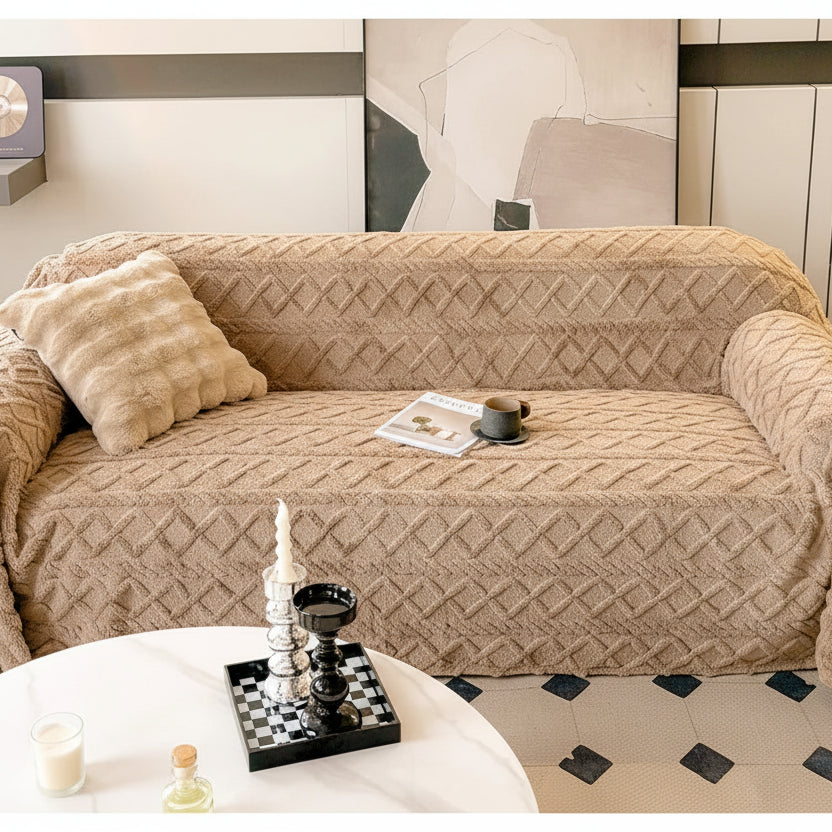 Beige textured blanket draped over a sofa with close-up shots of the fabric.
