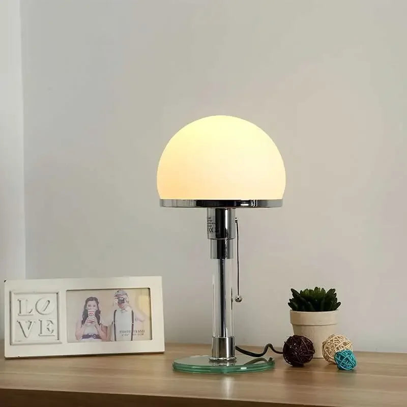 Table lamp on a wooden surface with a neutral background