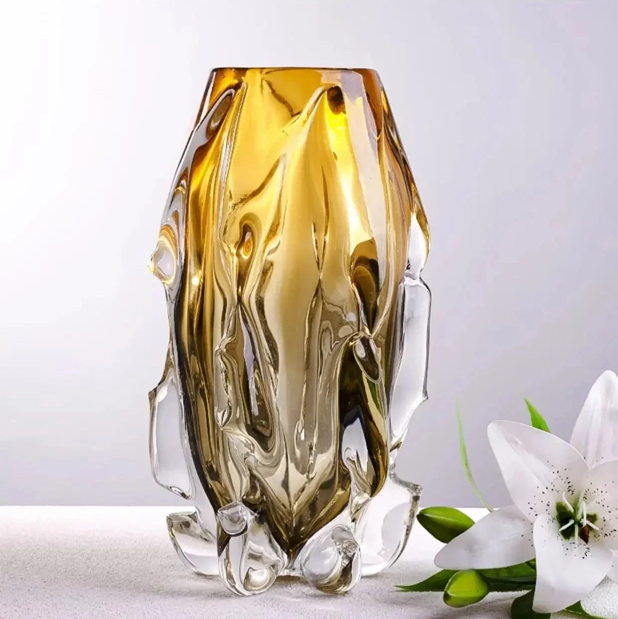 A large 28.3cm handcrafted amber crystal glass vase with a modern irregular bump design.