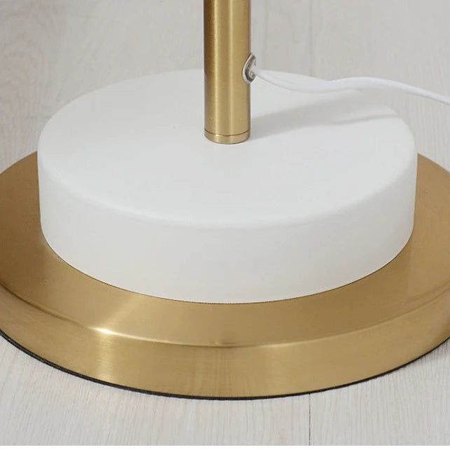 Round Base Detail — Close-up of the round floor lamp base with white centre and gold-tone outer ring.