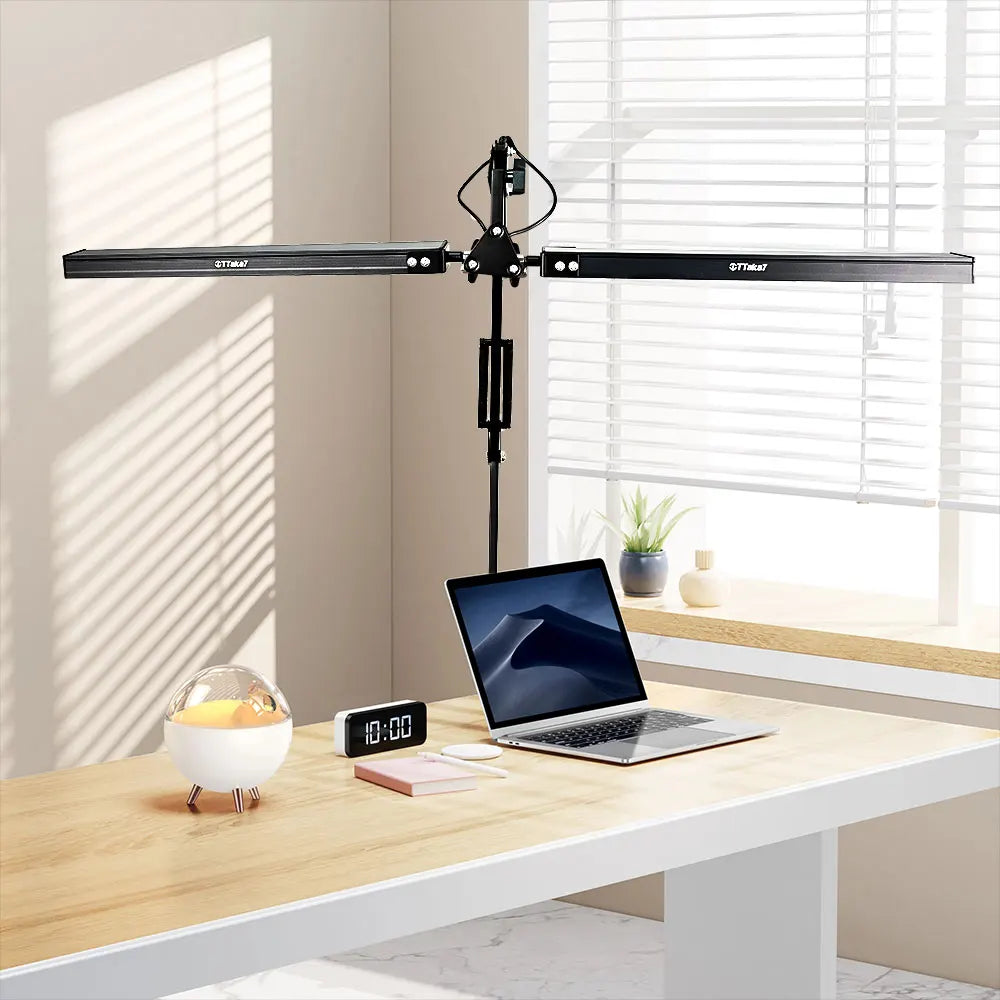 Laptop on a desk with a dual light source desk light