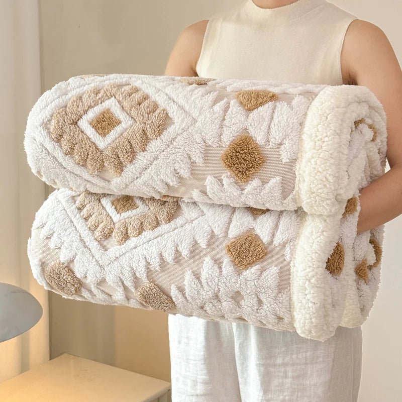 Person holding a sand dune textured blanket with geometric pattern