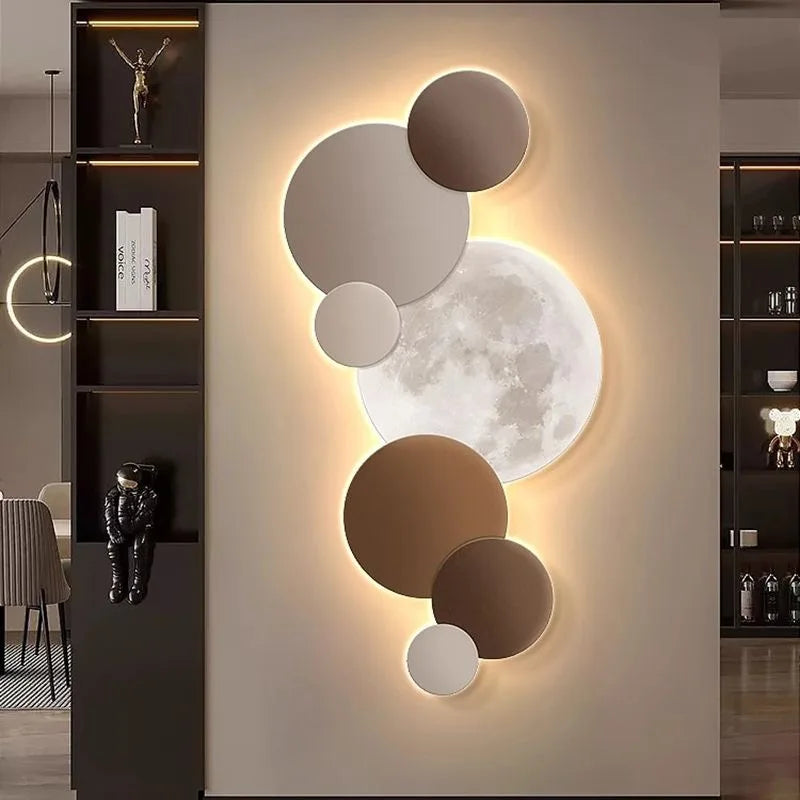 Terracotta and taupe moon wall light illuminating a hallway entrance