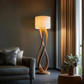 Interwoven ribbon wood floor lamp with soft fabric shade and round base