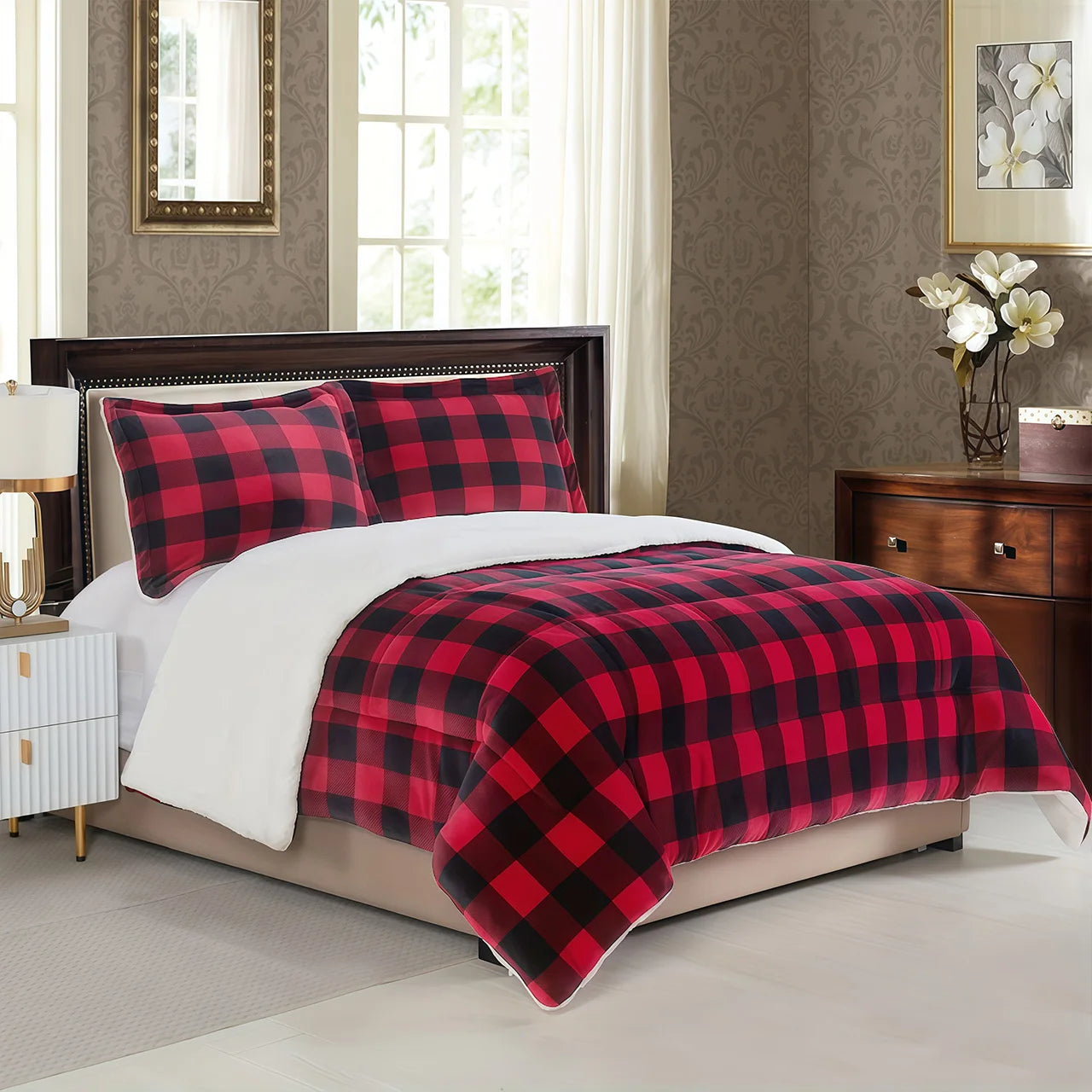 Red and black plaid comforter on a bed in a bedroom setting.