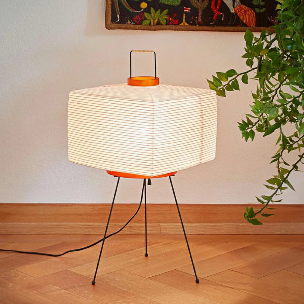 Modern Japanese floor lamp with a white lampshade.