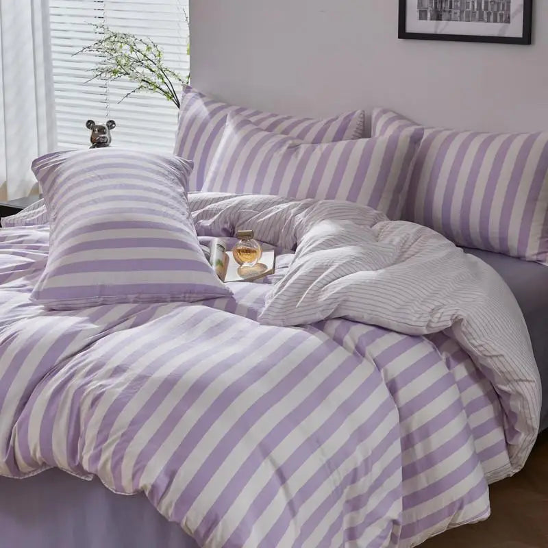 Lavender and white striped Polyester bedding set styled in a bright bedroom