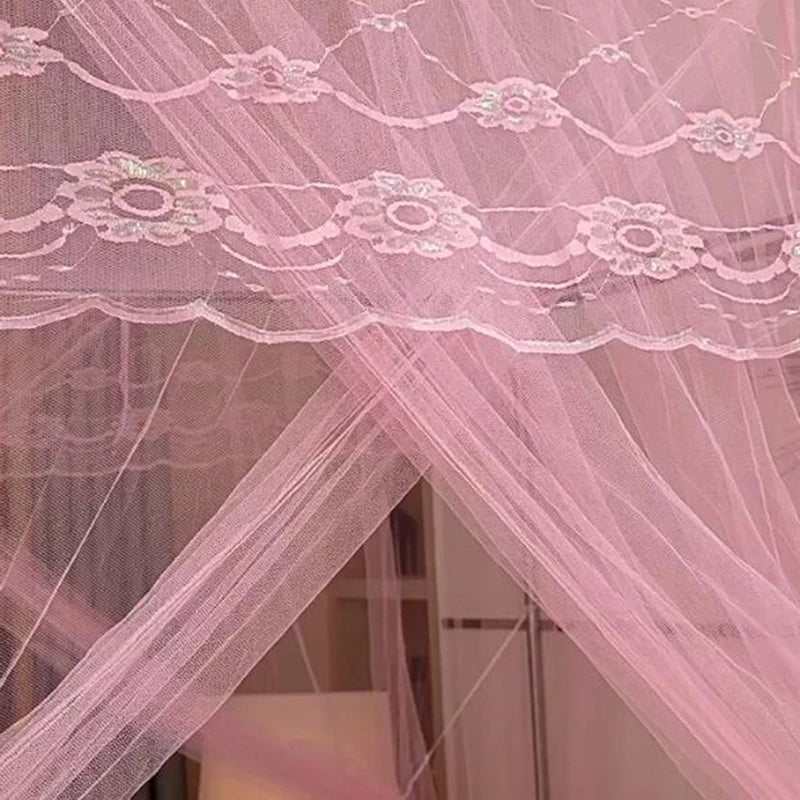 Pink sheer mesh curtain with embroidered floral lace trim. 