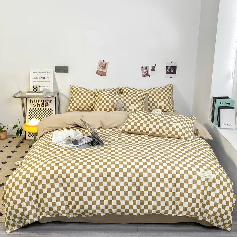 Tan and white checkerboard duvet cover set with matching pillowcases dressed on a double bed in a modern styled bedroom
