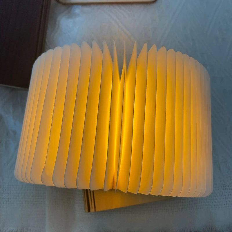 A paper lamp on a textured surface