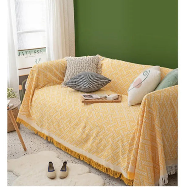 Yellow sofa with patterned cushions in a living room setting