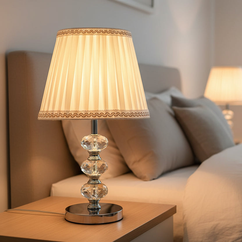 table lamp with a timeless cream-colored pleated fabric shade.
