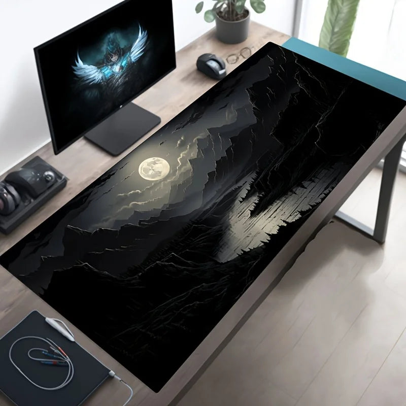 Extended mouse pad with all-black moonlit mountain and river landscape, shown flat and rolled
