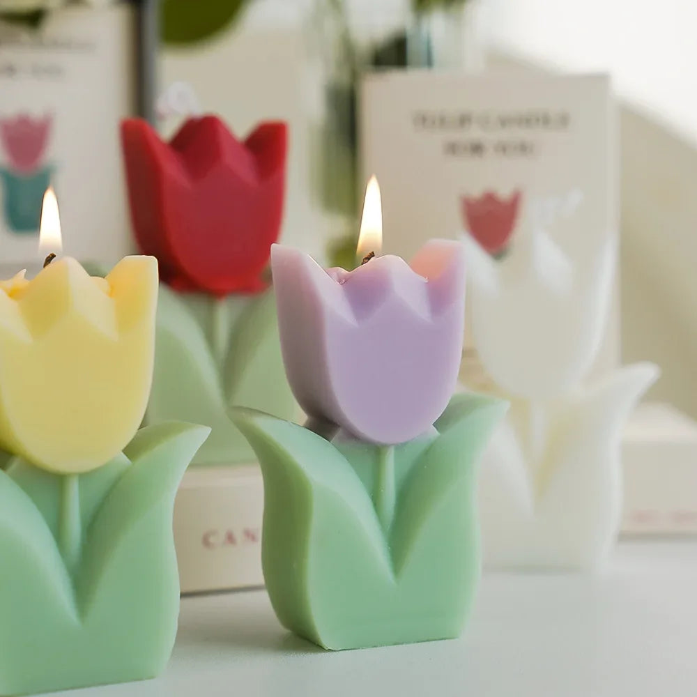 Tulip-shaped scented candles in various colours with a blurred background