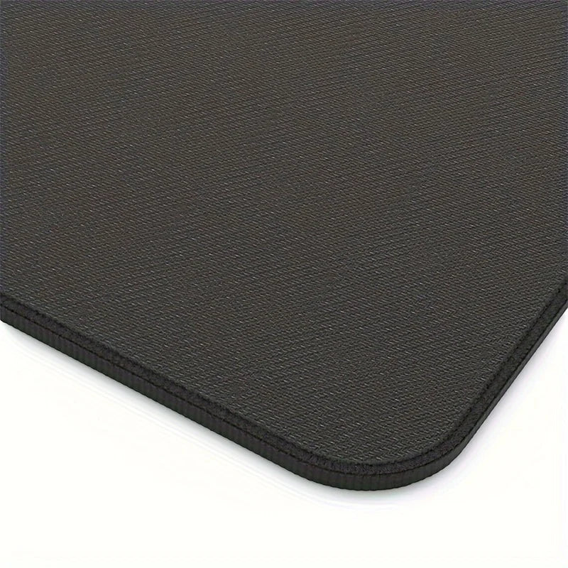 Base of a black mouse pad with a textured surface on a white background