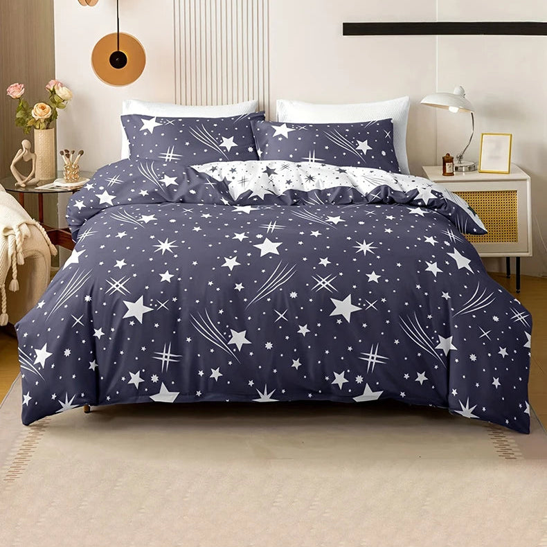 Navy blue bedding set with star pattern on a bed in a bedroom.