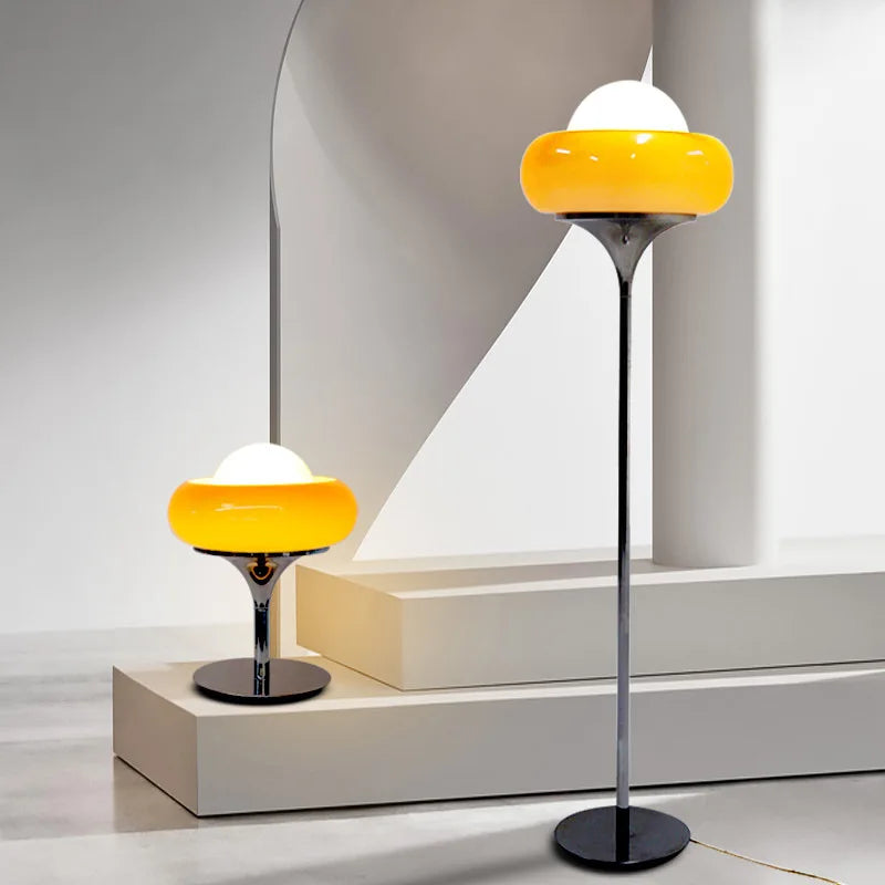 Modern floor and table lamp with yellow and white shade on a neutral background