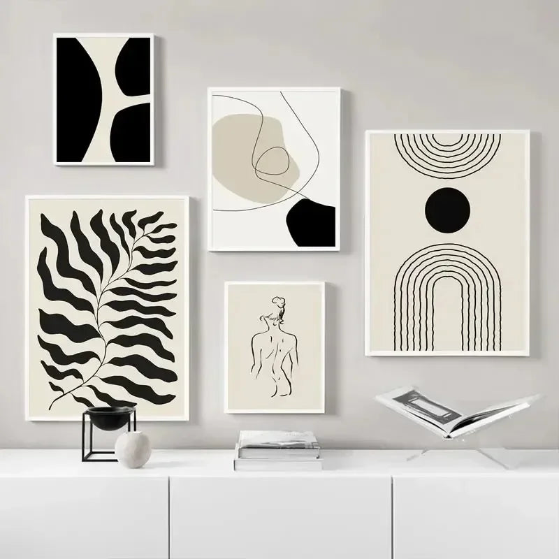 Set of abstract art prints on a wall with a minimalistic decor.