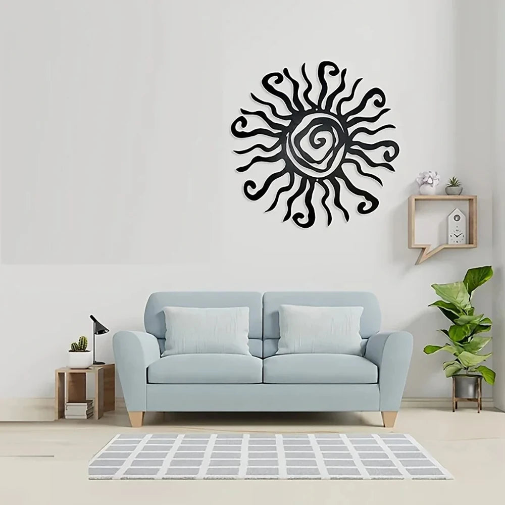 Decorative sun wall art above a light blue sofa in a living room setting.