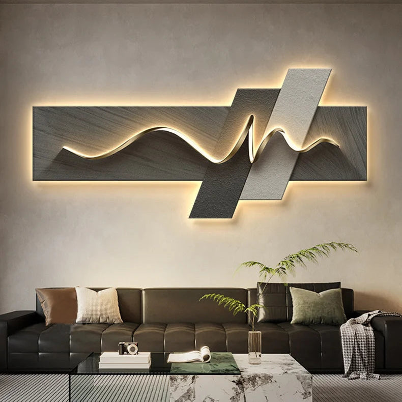 Modern living room with a stylish wall light art piece and a sofa.