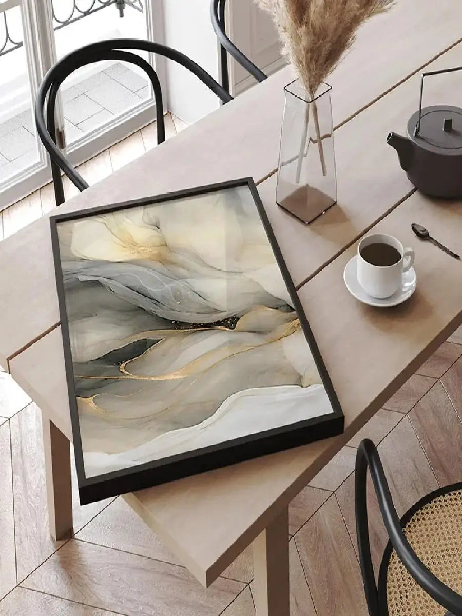 Close-up of Style A marble print in a sleek black frame on a wooden table.