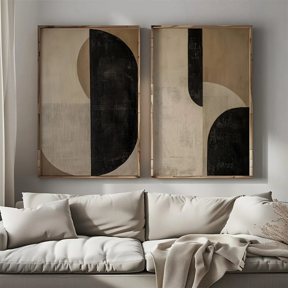 Framed mockup of a 2-piece abstract canvas set with black curved forms and warm neutral textured backgrounds