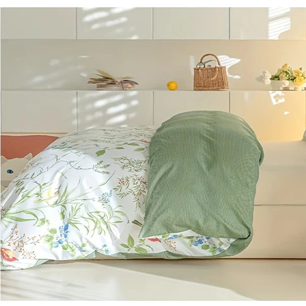 Close-up of floral duvet cover set with green reverse and machine washable detail